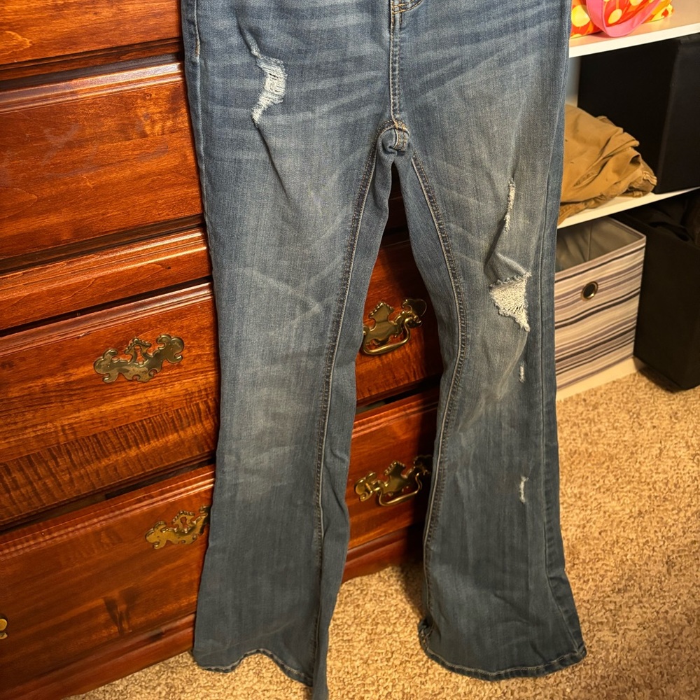 Distressed boot cut jeans
